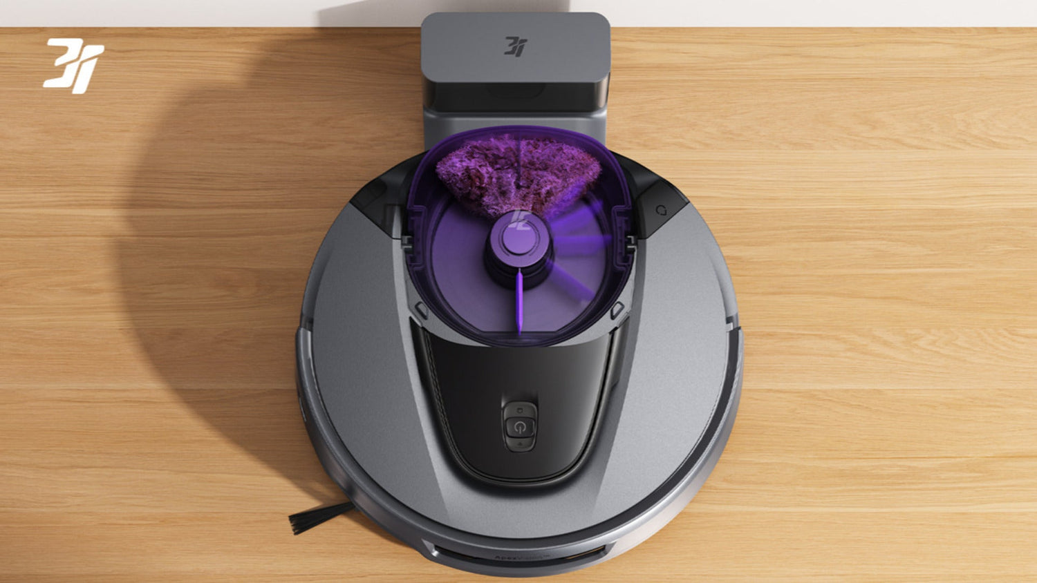 Widok z bliska na obrotowe szczotki i ssawkę robota sprzątającego w trakcie pracy