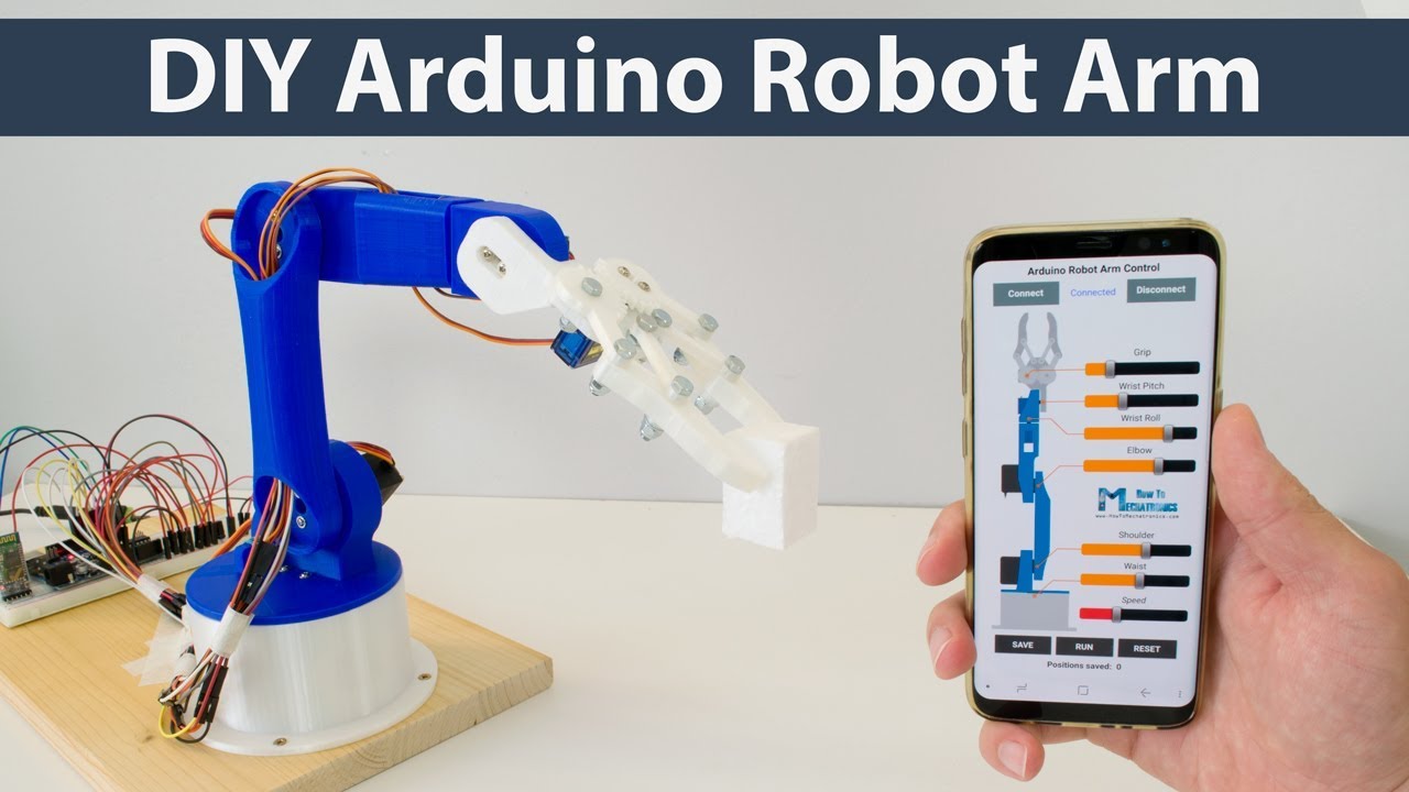Chwytak ramienia robota zbudowany z drewna i serwomotora z gumowymi końcówkami